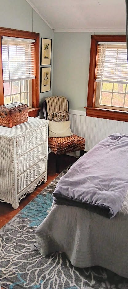 Hooks for clothing in bedroom, chest of drawers. A full closet for extra clothing is in living room.