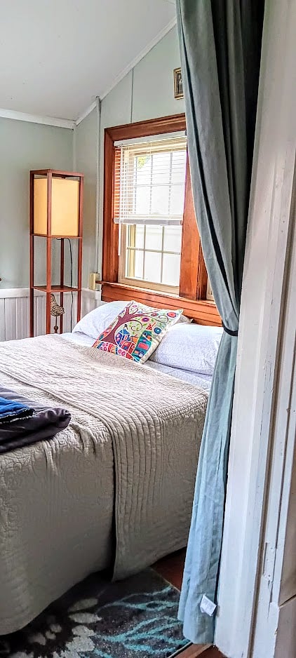 Bedroom overlooking the backyard and garden.