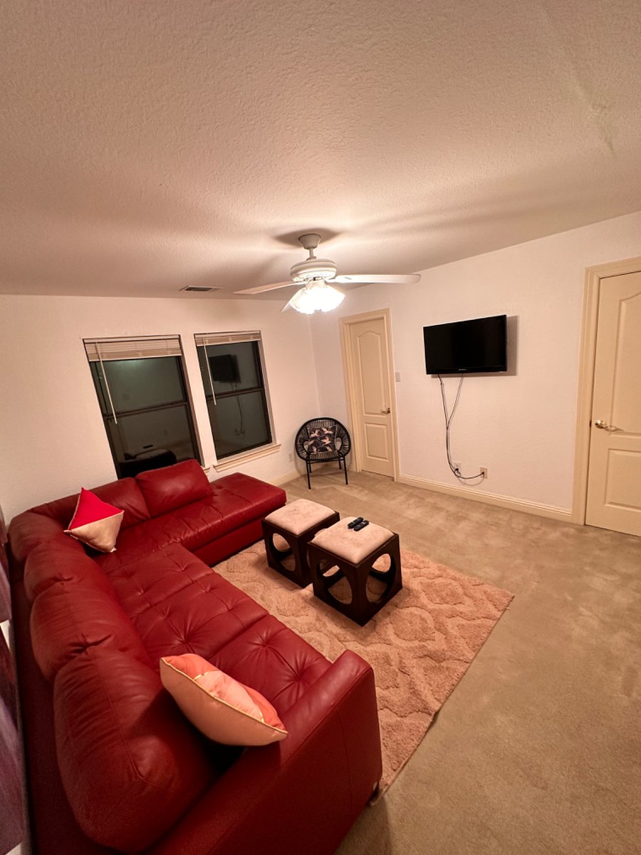Secondary bedroom is converted to a living room, TV, Roku, a spot to relax