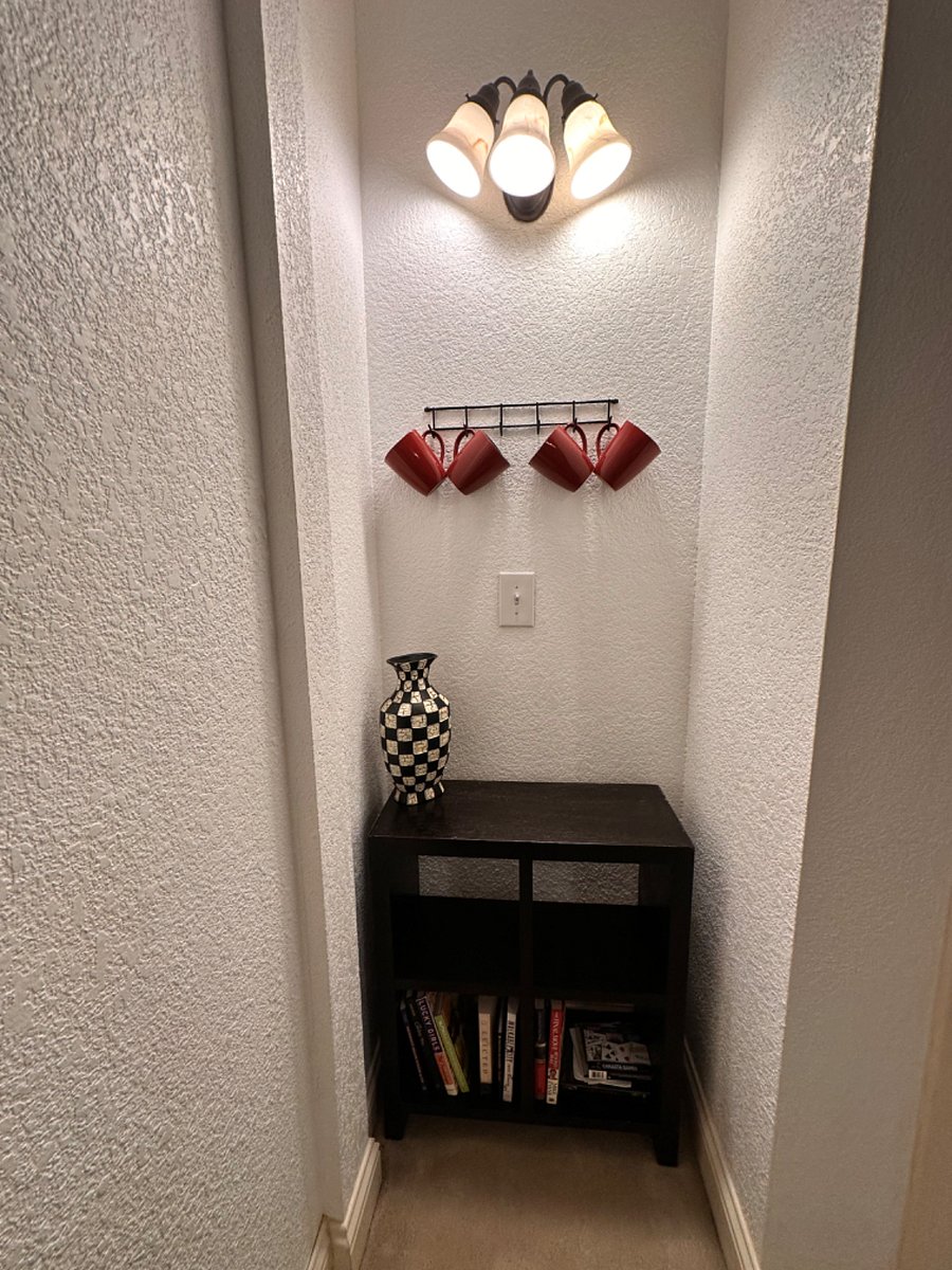 Coffee bar in bedroom with a space for books and games and Storage