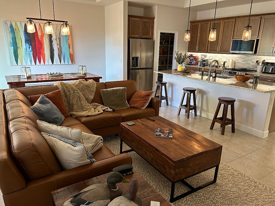 Large living area with large kitchen w/island and dining area.