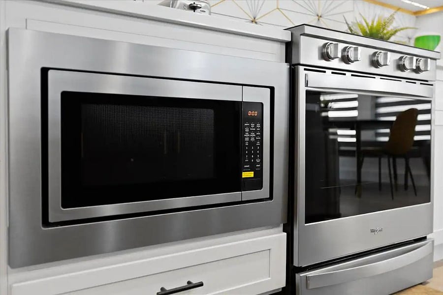 Built in microwave under the cabinet.