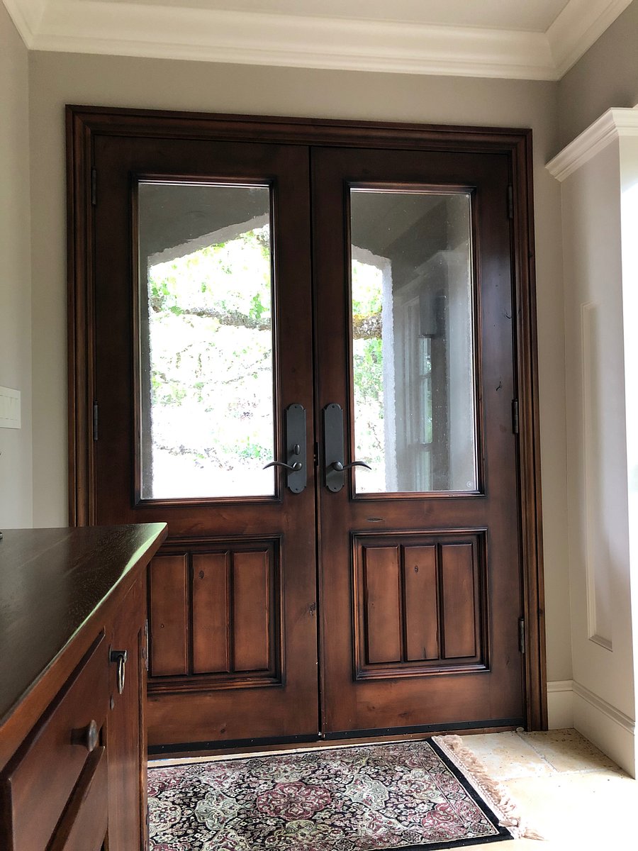 Inside of first set of custom double doors into entranceway. Second set of doors are the same but solid wood. Entire house is monitored by Bay Alarm supplemented with Google Nest doorbell and outside security cameras and floodlights surrounding house.