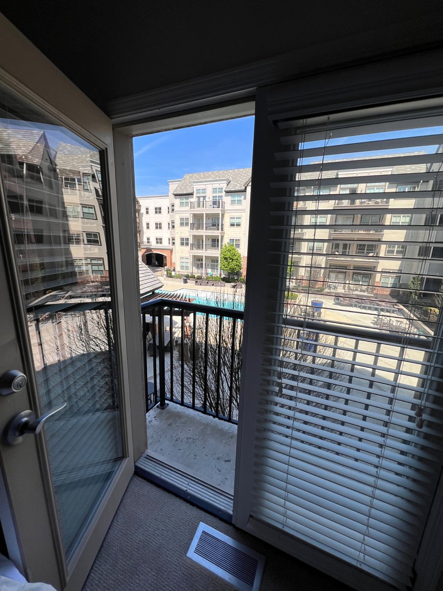 View from bedroom overlooking pool area