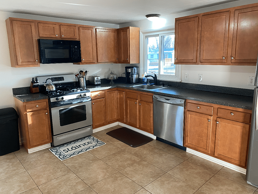 Fully stocked kitchen with pots/pans, spices, utensils, coffee maker, tea pot, and more!