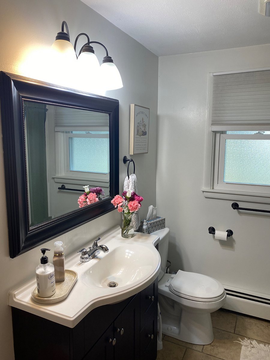 Full bathroom with lots of shower shelves and shelves in the bathroom closet. A guest favorite: the towel warmer in the bathroom!