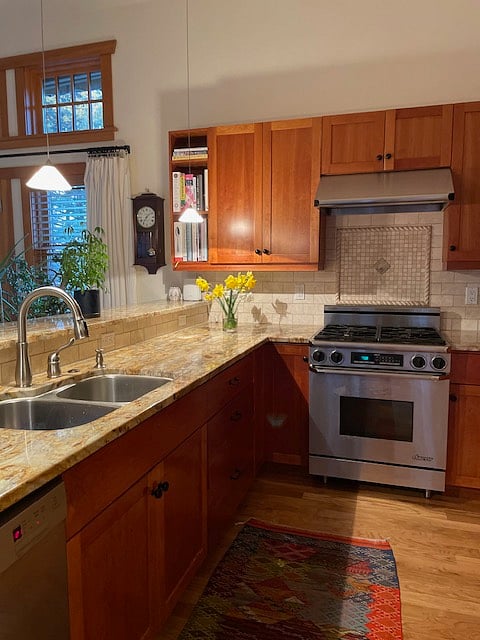 High end appliances and granite counters in the kitchen.