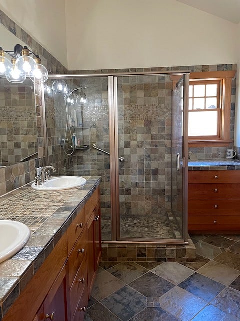Fully tiled bathroom.