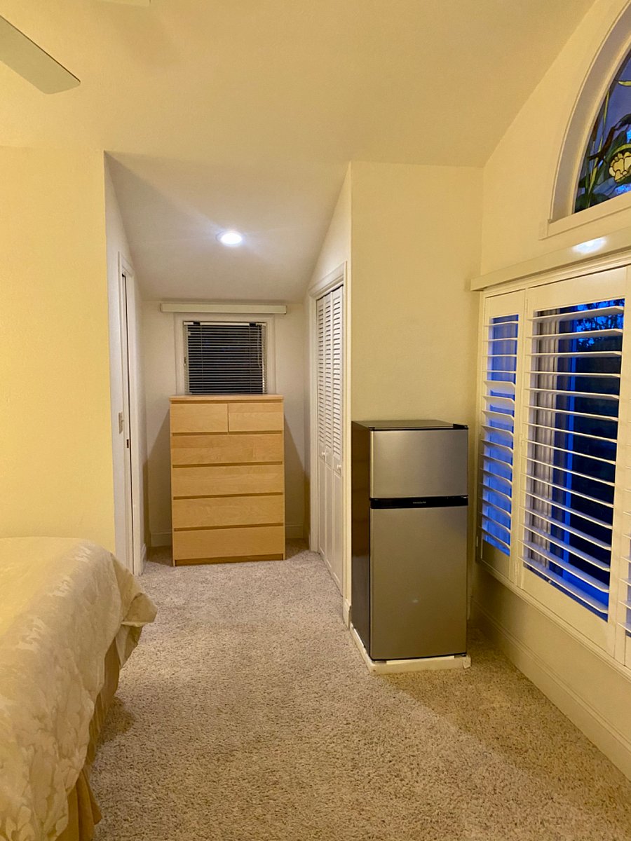 A large chest of drawers, and new refrigerator. 