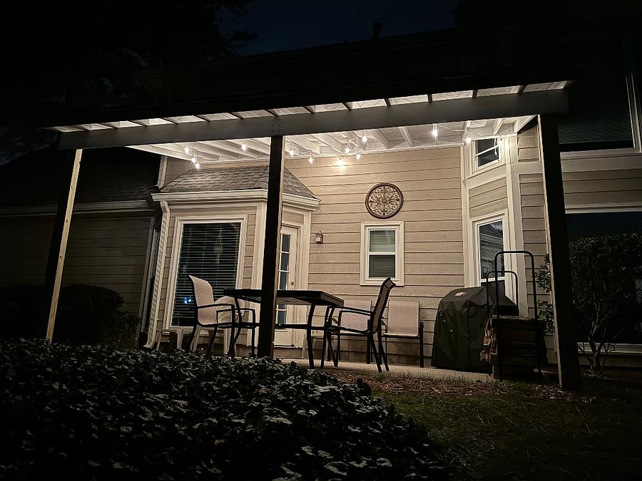 Private Patio with new furniture, grill, and lighting