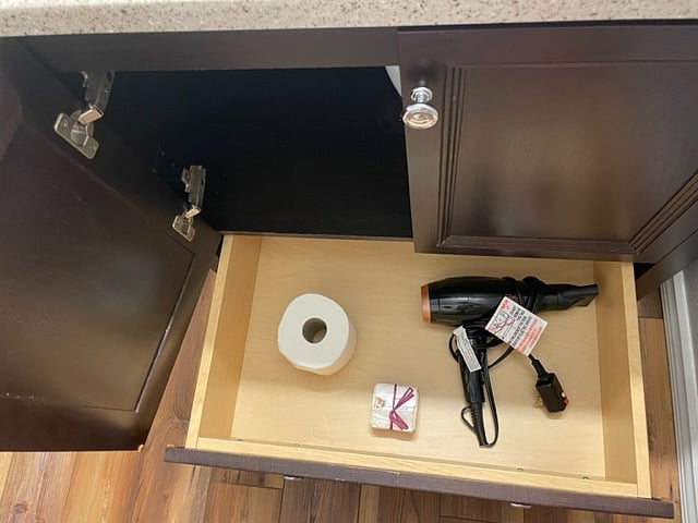 Providing hair dryers, spare toilet paper, and starter toiletries in each bathroom