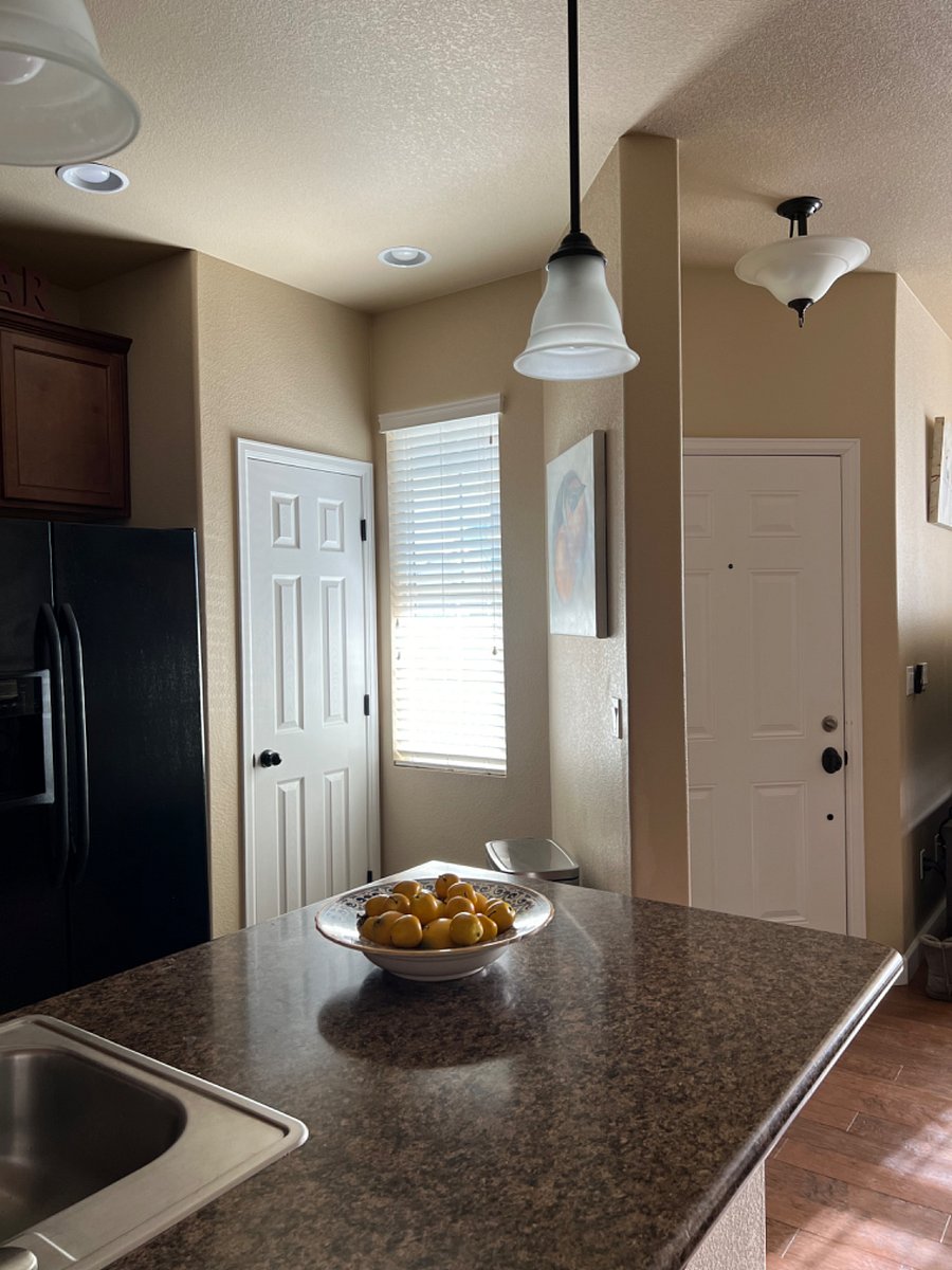 Kitchen pantry/window with front door on the right.