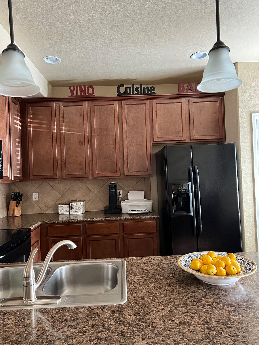 Kitchen with full fridge/printer.