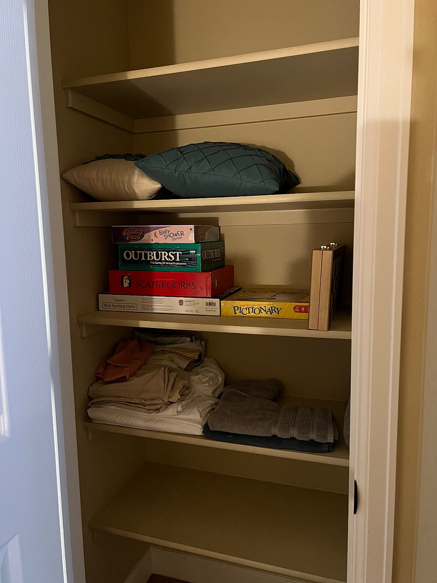 Upstairs hall closet with board games.