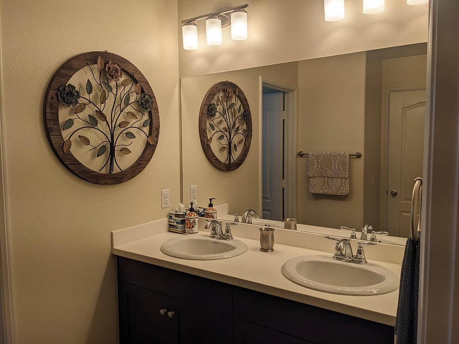 Private bath with dual sinks.