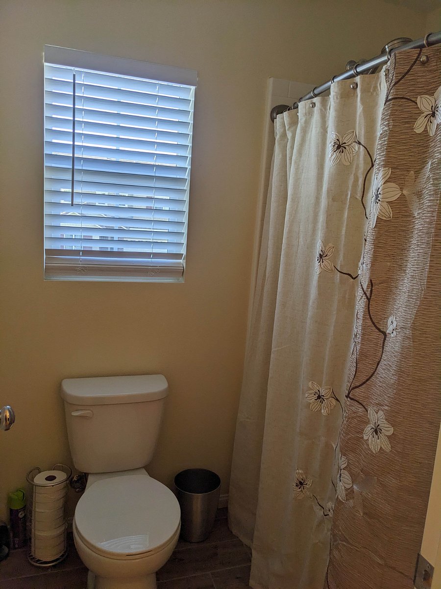 Private bath water closet and tub/shower combo.