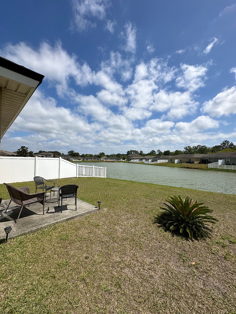 Outside Porch Area with Lake Views & Backyard