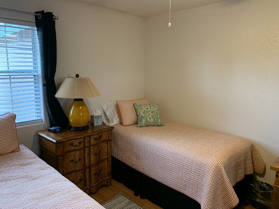 Bedroom 2 with two twin beds and a second desk.