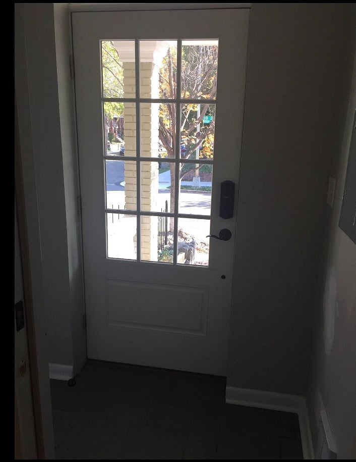 Secure front door to well-lit foyer features keyless touchpad entry. Foyer shares door with upstairs unit. 