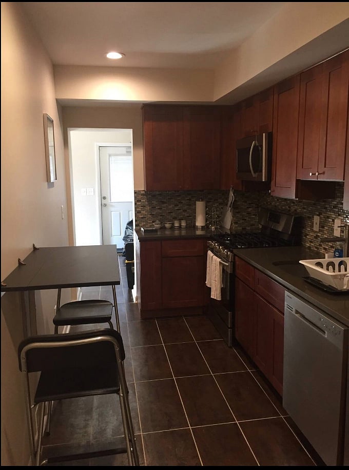 Wide Galley Kitchen with fold-down dining table, and updated appliances.