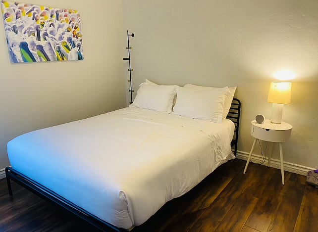 Queen size bed bedroom #2 also with a portable desk in room 