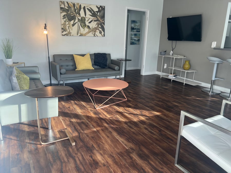 Living room area with open  kitchen bar area 