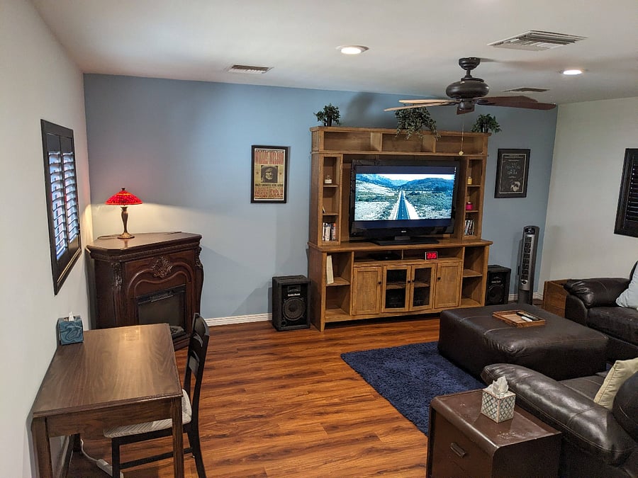 Den W/ electric fireplace and desk.