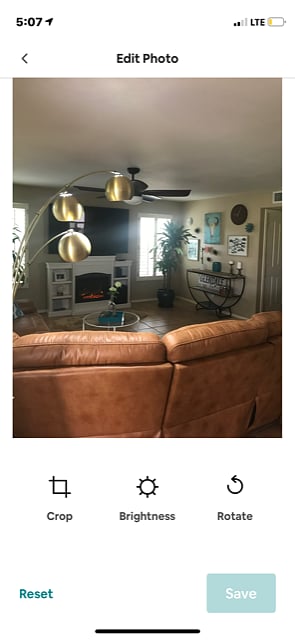 Living Room + Smart TV + Couch with two recliners built in + Remote Fireplace.