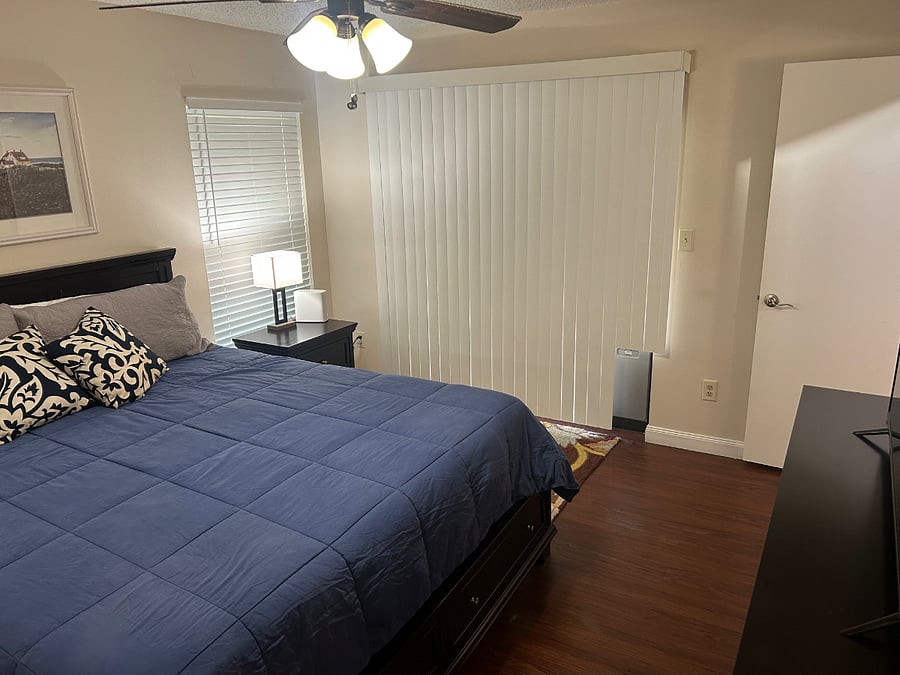 Master Bedroom. Sliding glass window has a doggie door that leads into the back porch and another doggie door that goes into an enclosed side yard.