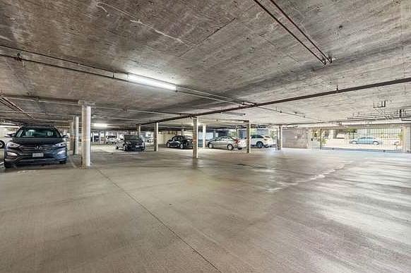 Gated and covered garage with plenty of guest spots