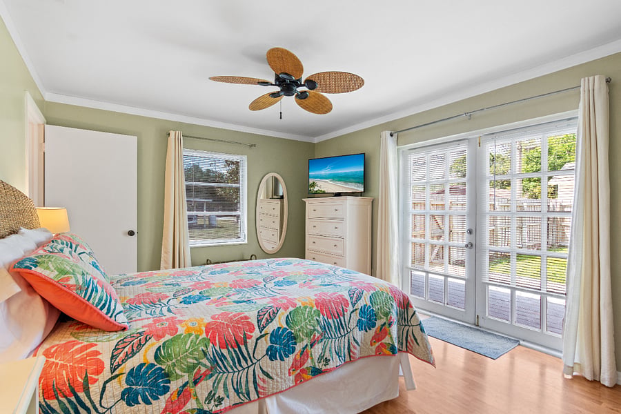 Main bedroom with ensuite bath and easy access to the fully fenced backyard
