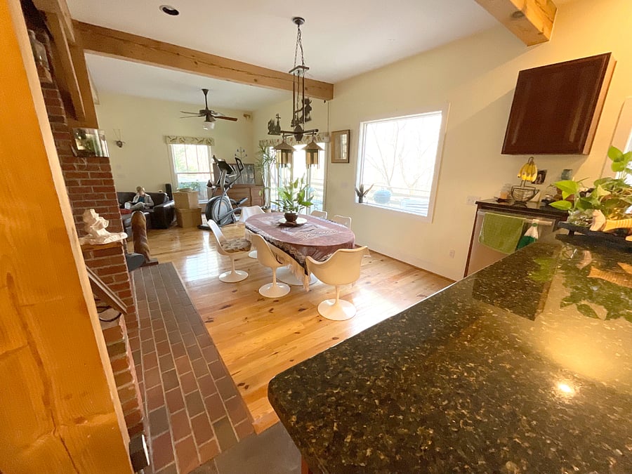 Living and dining spaces surround the fire place.