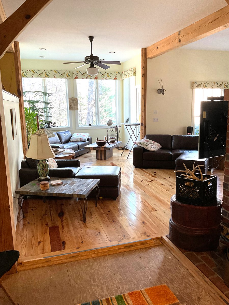 Living and dining spaces surround the fire place.