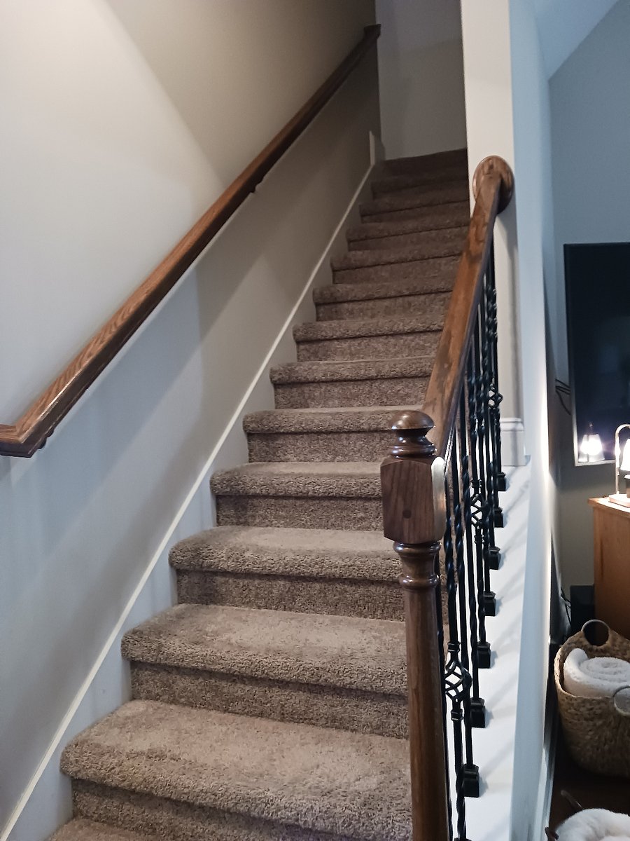 Stairs leading upstairs to 3 living area.