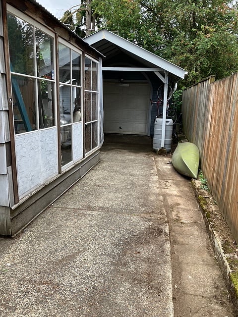 Side yard with covered bike parking.