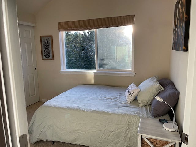 Updated room! We rearranged the furniture, added different bedding, art, tv w/ Roku - View of room from door, emphasizing window