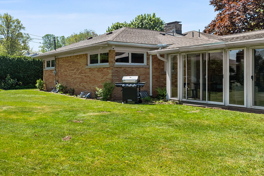 Back Yard showing Sunroom and Grill
