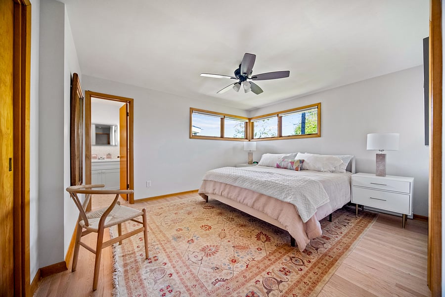 Owner's Suite with ensuite bathroom, shower and single vanity
Amazon Fire Smart TV over chest of drawers - not shown