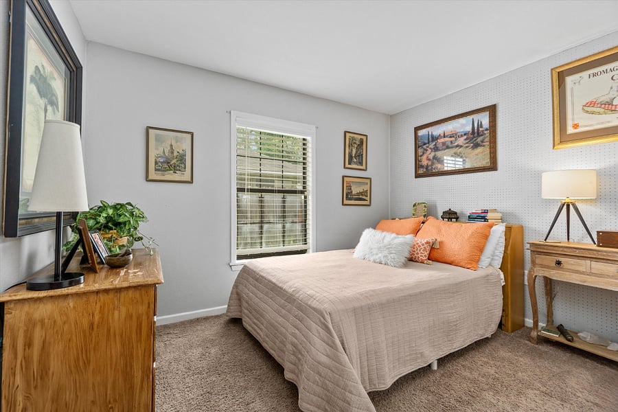 2nd bedroom with closet, desk and storage cabinet.