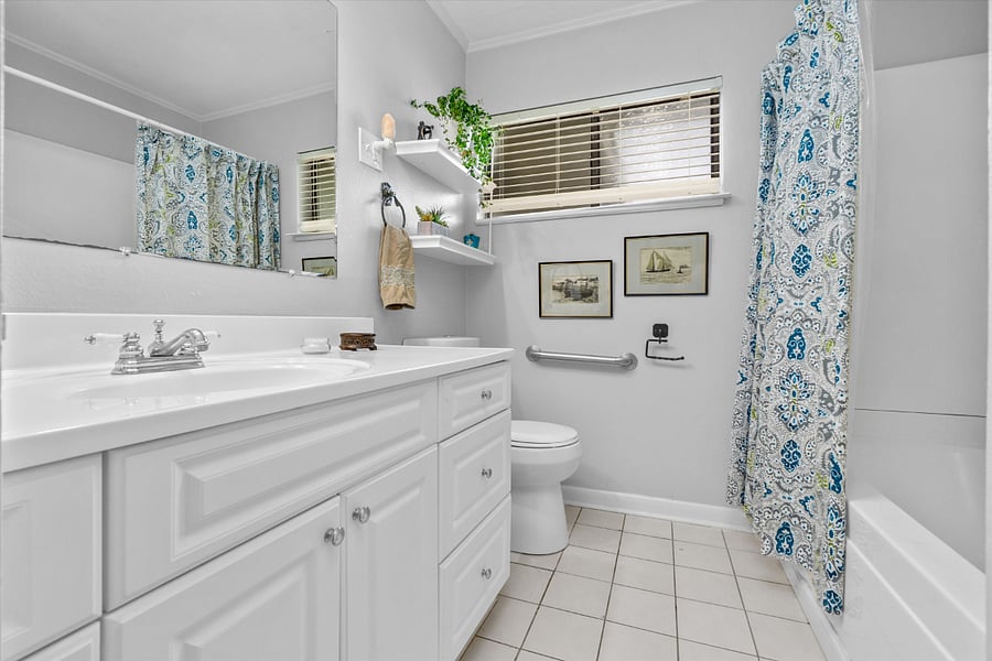 Beautiful full bath with nice shower head!! and plenty of storage.