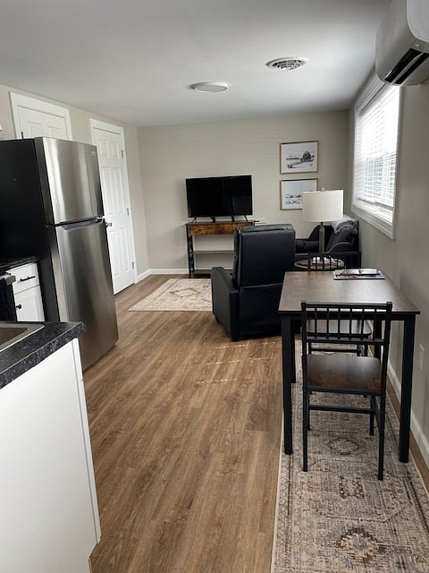 living area; bathroom door to left of TV