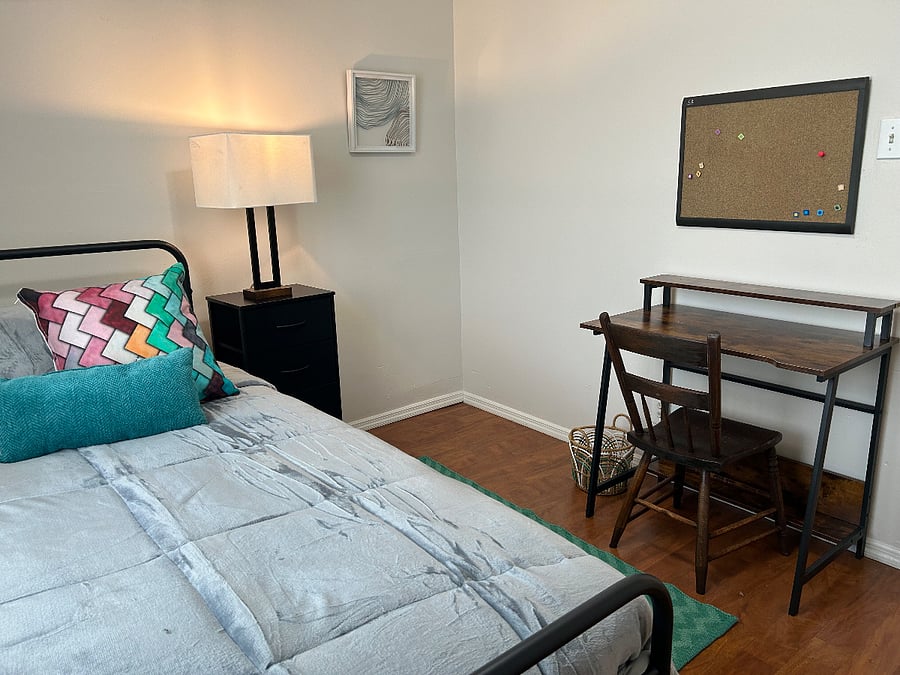 XL twin bed and laptop desk in 2nd bedroom