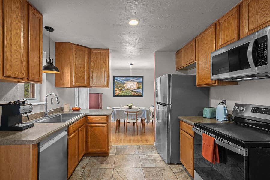 The kitchen is a perfect size with everything you need. A new GE stove, a new Bosch dishwasher, and plenty of storage make this kitchen both warm and efficient. 
