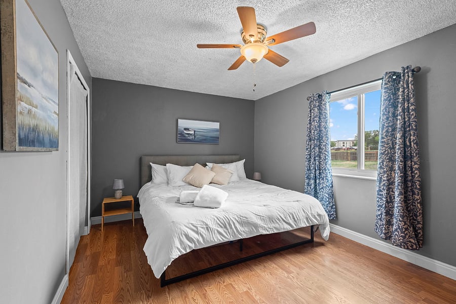 The main bedroom is spacious and looks out over the large fenced back yard. Black out curtains, a generous closet, and an en suite bath with shower and bidet make this room comfortable and relaxing. 