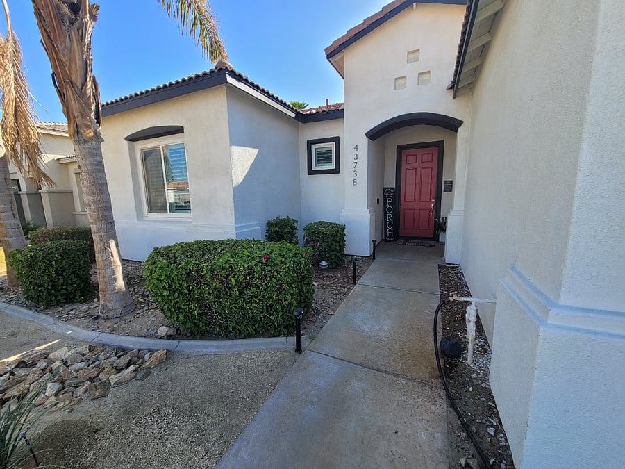 Front porch and outside of tenant bedroom (left window)