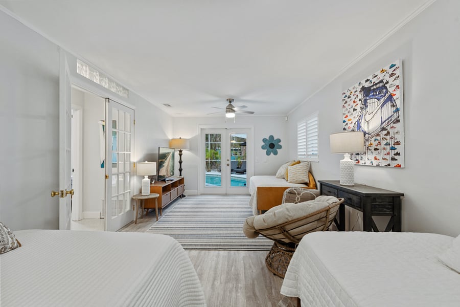 Main floor "bunk room" featuring a double bed and 2 twins
