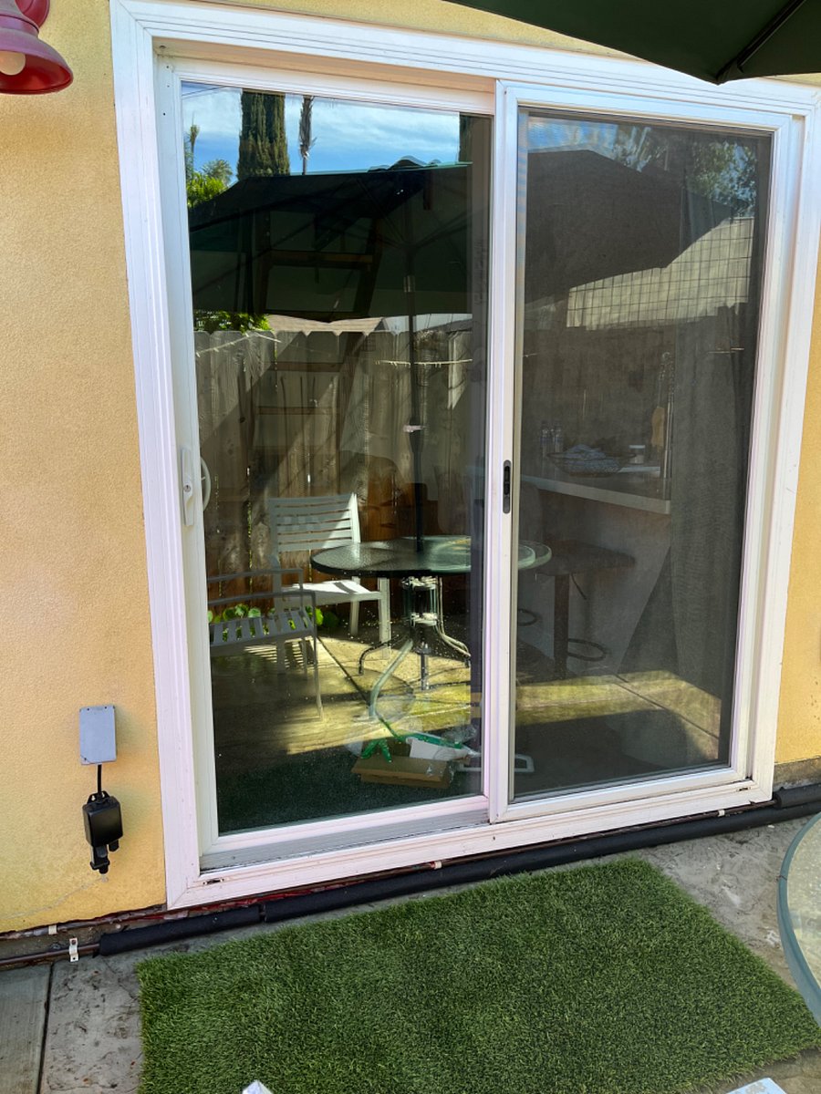 Sliding glass door lets in lots of light.