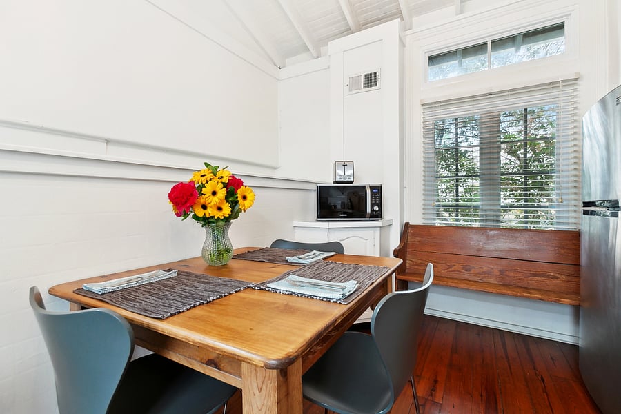 Beautiful breakfast table in the kitchen filled with natural light