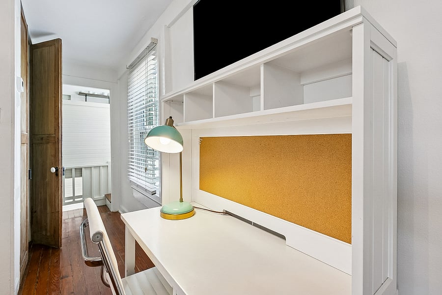 A closer look at the workspace and built-in shelving with convenient storage for books, personal items, and travel essentials