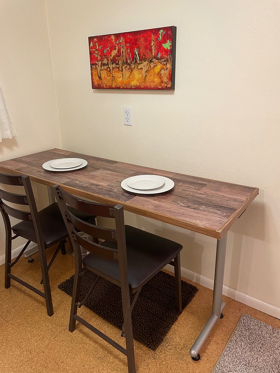 Kitchen eating area doubles as a work desk.